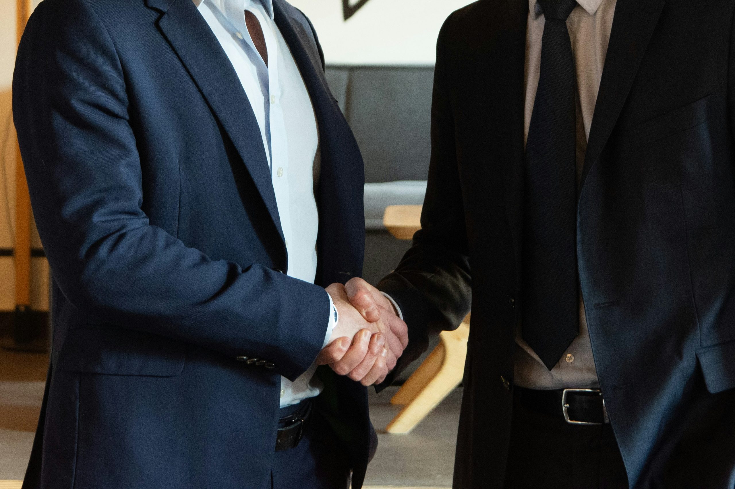 lawyer shaking hands with client