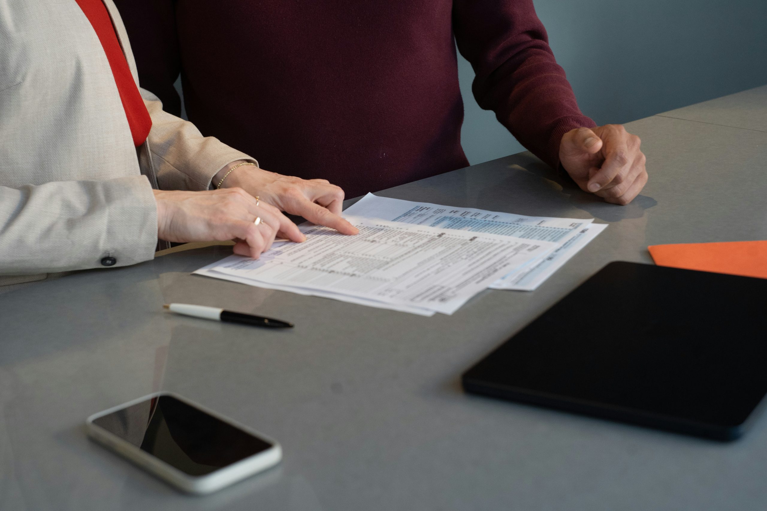 lawyer pointing out form for client