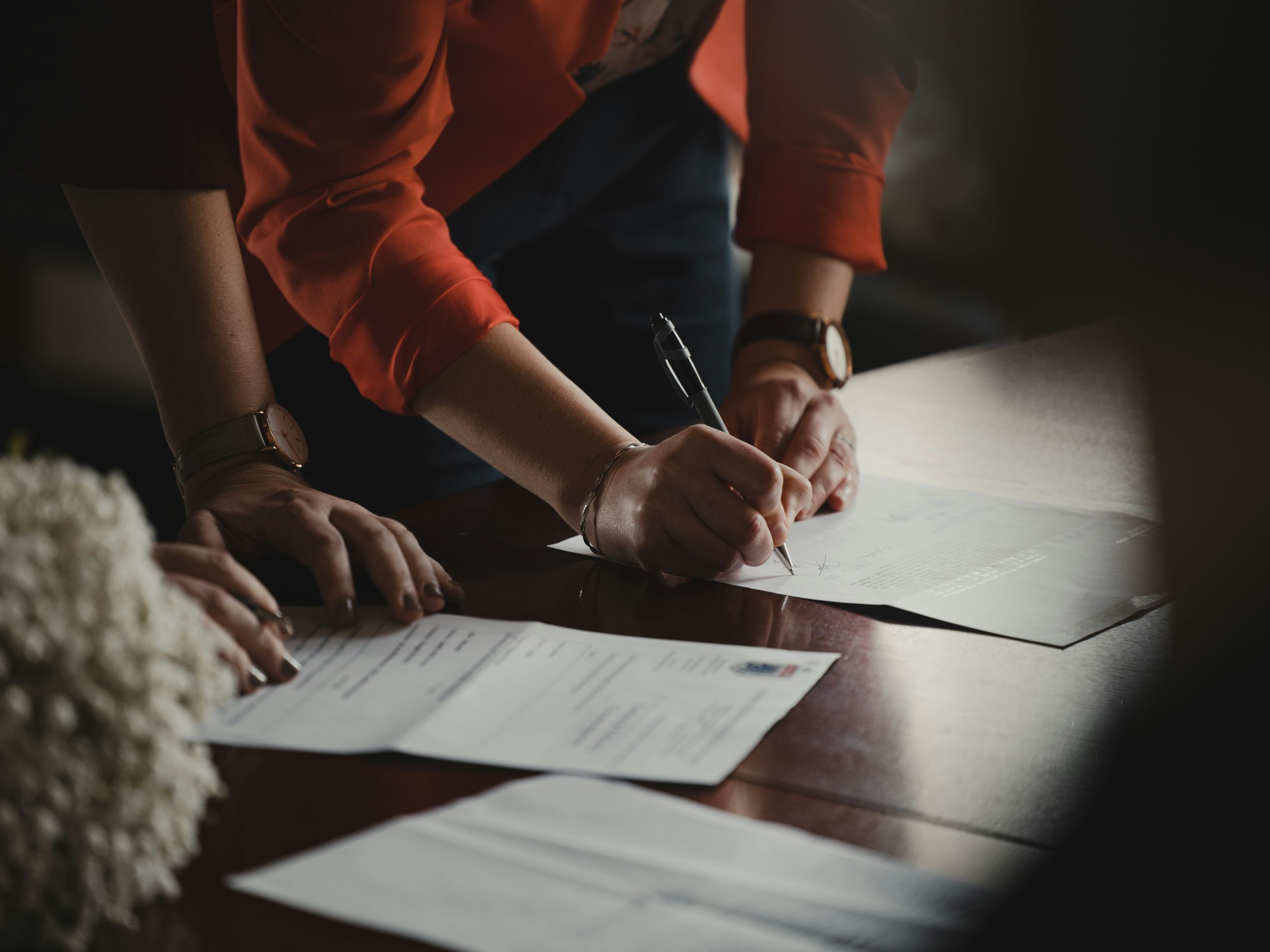 lawyer signing client documents